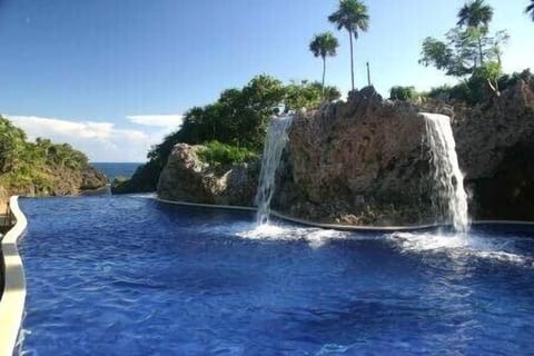 Infinity Pool with Private Beach beyond