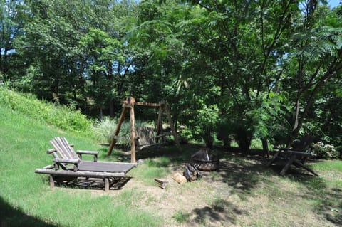 Back gathering area with fire pit and swing