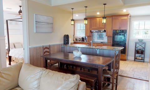 The Dining Table seats 10 +  Bar Seating at the island and 2 outdoor tables - One on the Covered Porch and one on the Open Patio