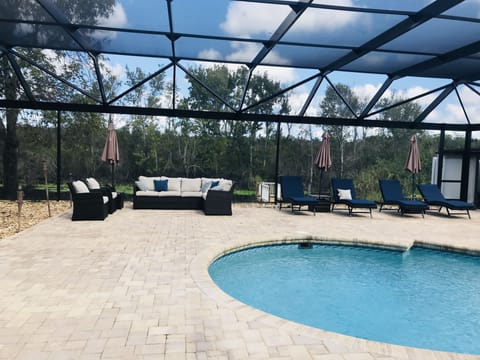 Resort like screened in pool deck