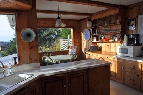 Kitchen and Breakfast nook. Windows overlook ocean. Very warm in the afternoon.