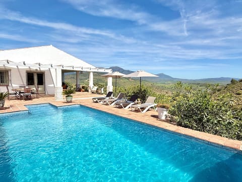 Swimming pool, BBQ terrace, 4 x sun loungers, alfresco dining table with views..