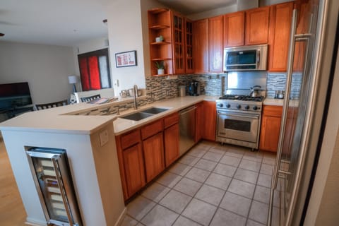 Large chef's kitchen with stainless steel appliance. 