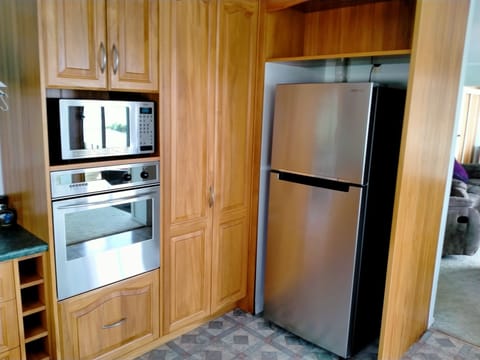 Kitchen - wall oven, microwave and fridge/freezer