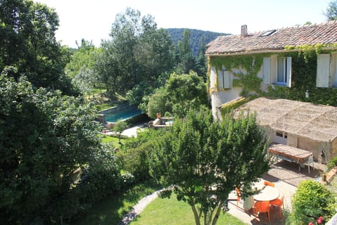 The house. The terrace and the garden, with the swimming pool in the background