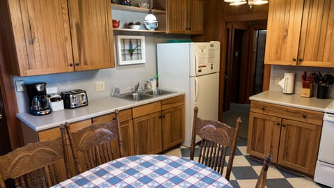 Full sized refrigerator, toaster and coffee maker.