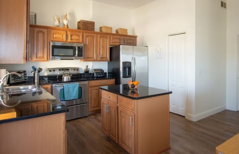 Additional angle features stainless steel appliances, kitchen island
