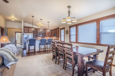 Dining Area - Enough seating for the whole family with five chairs and a bench.