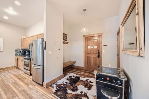 80s style arcade welcomes you to the unit.