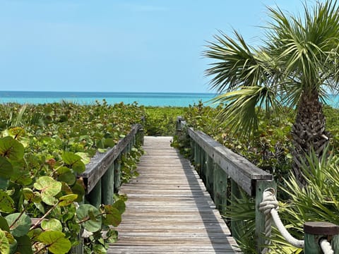 Our private walkway leading to pristine blue waters and never crowded beach
