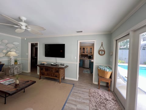 Enjoy the openess to the pool view.  Large screen ROKU smart TV