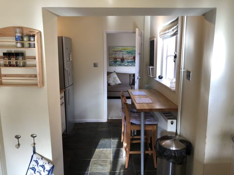 more Kitchen with breakfast bar, large fridge freezer, microwave