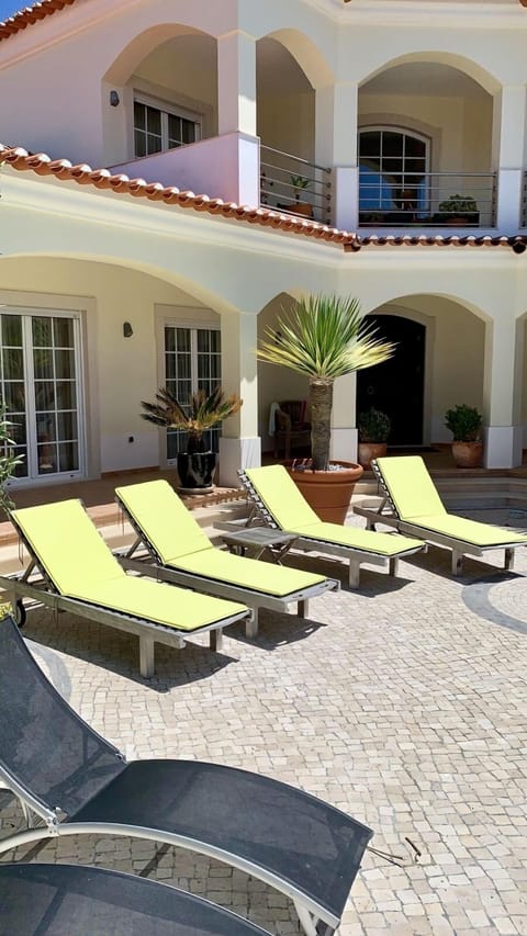 RELAXING IN FRONT OF THE VILLA