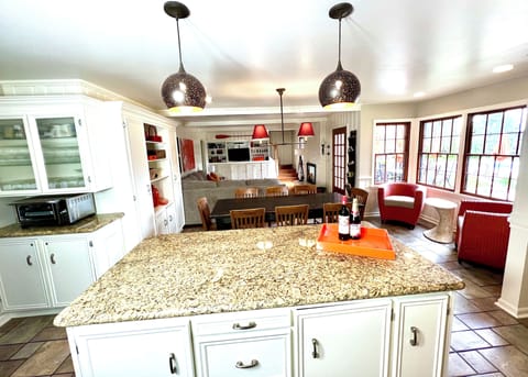 KITCHEN/GREAT ROOM: table seats 12 with leaves, SMART TV, bluetooth speakers