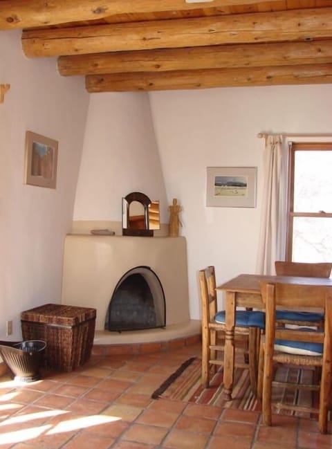 Wood burning kiva fireplace and dining area