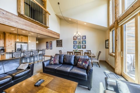 Living Area - Living area is ideally located within the open floor plan of the main level with easy access to the private balcony as well as the common areas of the home.