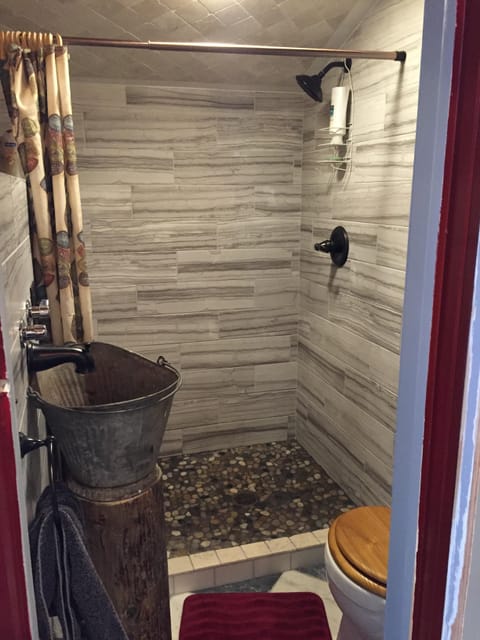 You've never seen a bathroom like it!  We turned an antique bucket into a sink.