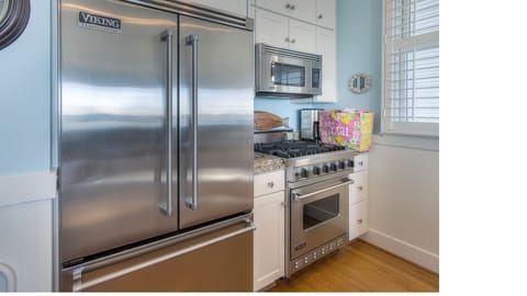 Full Viking Kitchen with Gas Range Wine Cooler and oversized Fridge