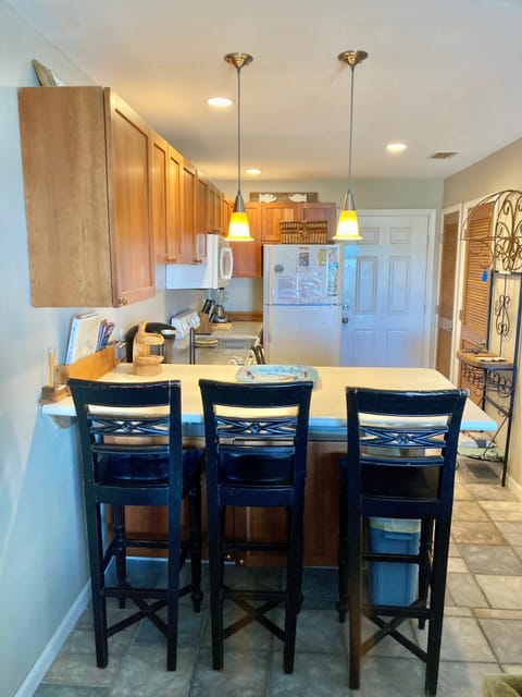 Front entrance, kitchen and bar.