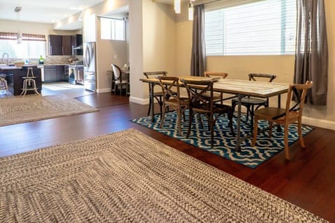 A large dining room table where you can serve meals for the whole family.