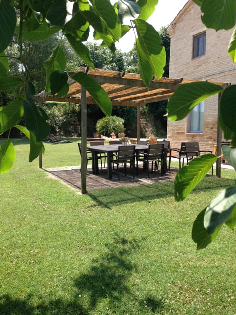 Outdoor dining with pergola providing shade