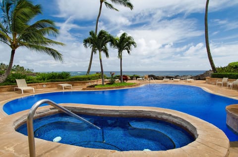 SHARED POOL AND HOT TUB AREA WITH OCEAN VIEWS
