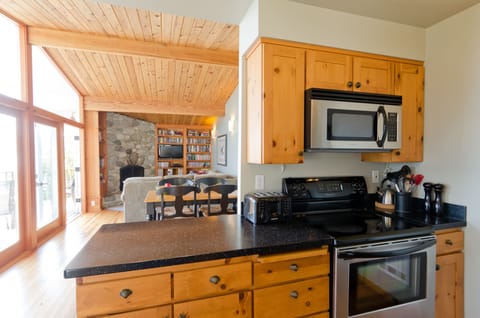 The kitchen is well stocked with the essentials including spices, flour & sugar.