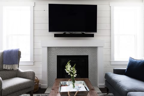 Fireplace and large TV in family room
