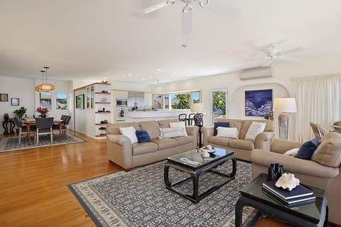 UPSTAIRS LIVING ROOM WITH KITCHEN IN THE BACKGROUND