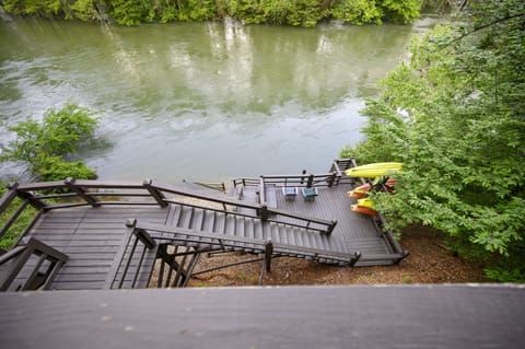 Welcome to Kingfisher with a deck leading the Mountain Fork River!