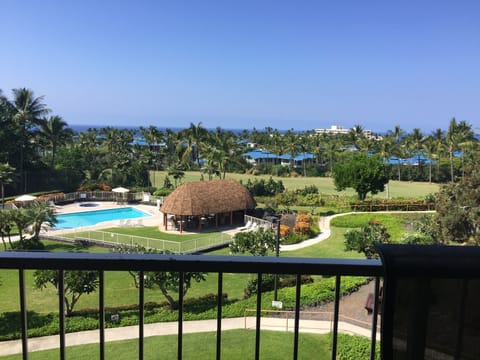 View of pool, fairway of Kona Country Club and ocean from lanai