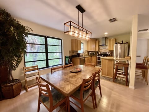Dining & kitchen. Living room on right. 
