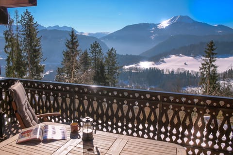 Balcony breakfast view, coffee and snow sparkle