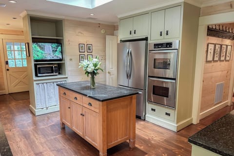 The skylit kitchen has the charm of an English cottage