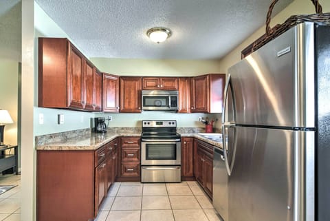 The fully equipped kitchen includes stainless steel appliances &sleek cabinetry.