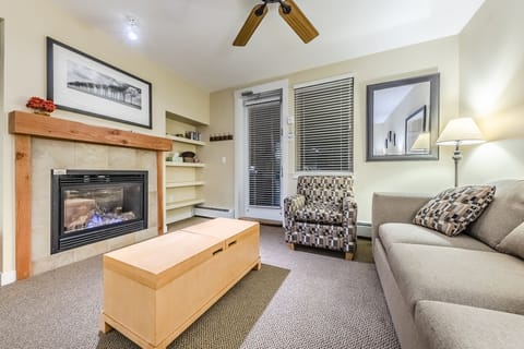 Living area - Queen size sofa sleeper, gas fireplace, flat screen TV, and access to private balcony.