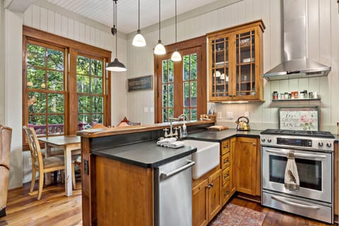 Kitchen with gas range stove, dishwasher, and drip-style coffeemaker.