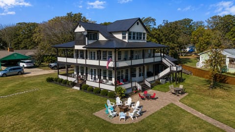 Huge home with large yard, 300 feet of private lakefront, covered porches,  private dock, fire pit and game room