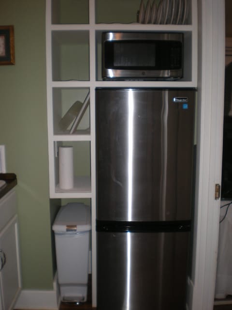 Full sized refrigerator/freezer and microwave along with dishes for 4 guests!