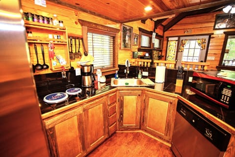 - Fully equipped rustic kitchen for easy cabin cooking   - Cabin essentials ready for forest getaway meals   - Warm wood design creating inviting culinary space