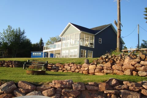 Beach side of house with fire pit