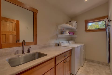 Large bathroom vanity in laundry room - very close to upstairs bedrooms.