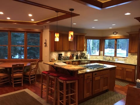 Large Kitchen and island to enjoy cooking and hanging together. Cherry cabinets.