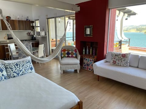 Living room with hammock and view to the lake
