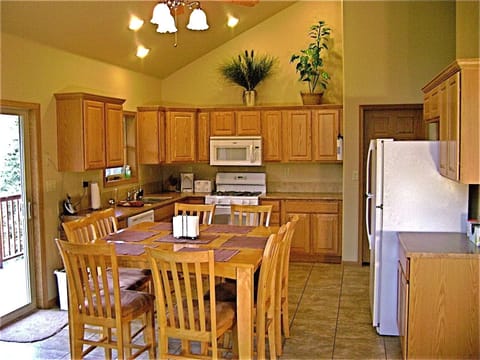 Large, open kitchen with bistro table. Seats 8 comfortably.
