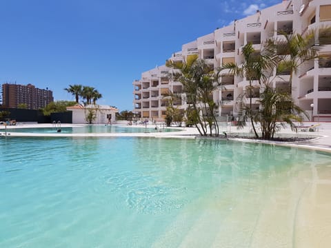 Large heated pool with sunbeds