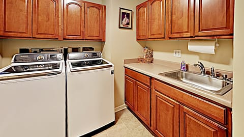 Two washers in the laundry room (two dryers in the adjacent garage landing)