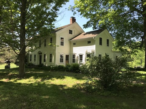 1840 Center Hall with 1810 Eyebrow original house with maple tree lined semi-circle driveway.