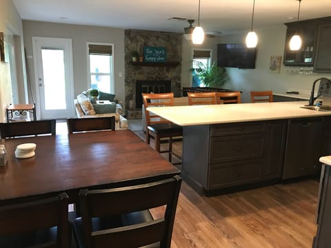Bar height dinette table and views of the open kitchen and family room