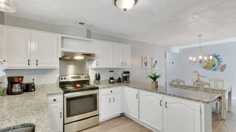 Basic kitchen supplies are stored in the cabinets. 